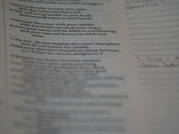 A close-up view of a printed page showcasing text from a book. The text seems to be a religious or inspirational passage. The image is focused on the words, with handwriting faintly visible on the right margin.