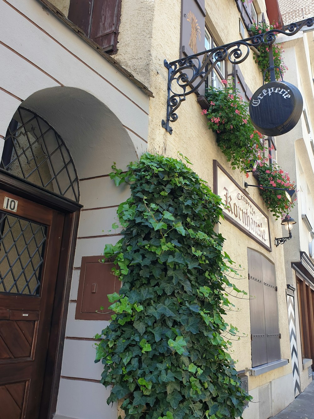 a building with plants growing on the side