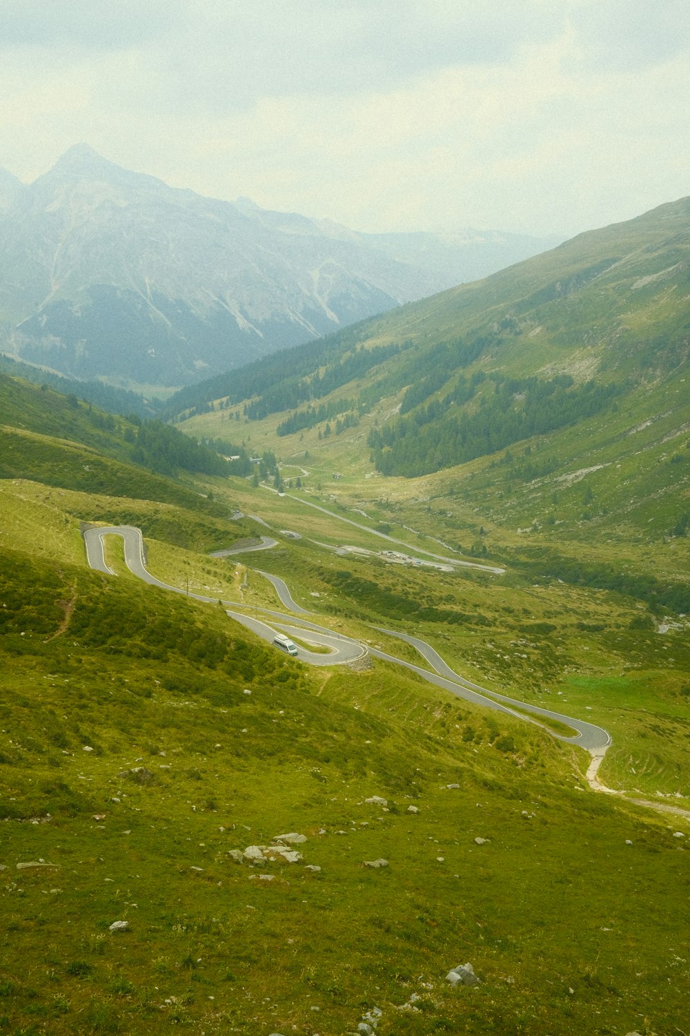 a winding road through a valley