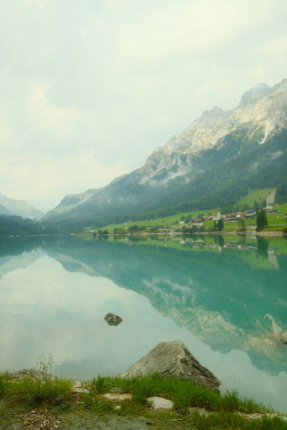 a lake with a town in the distance