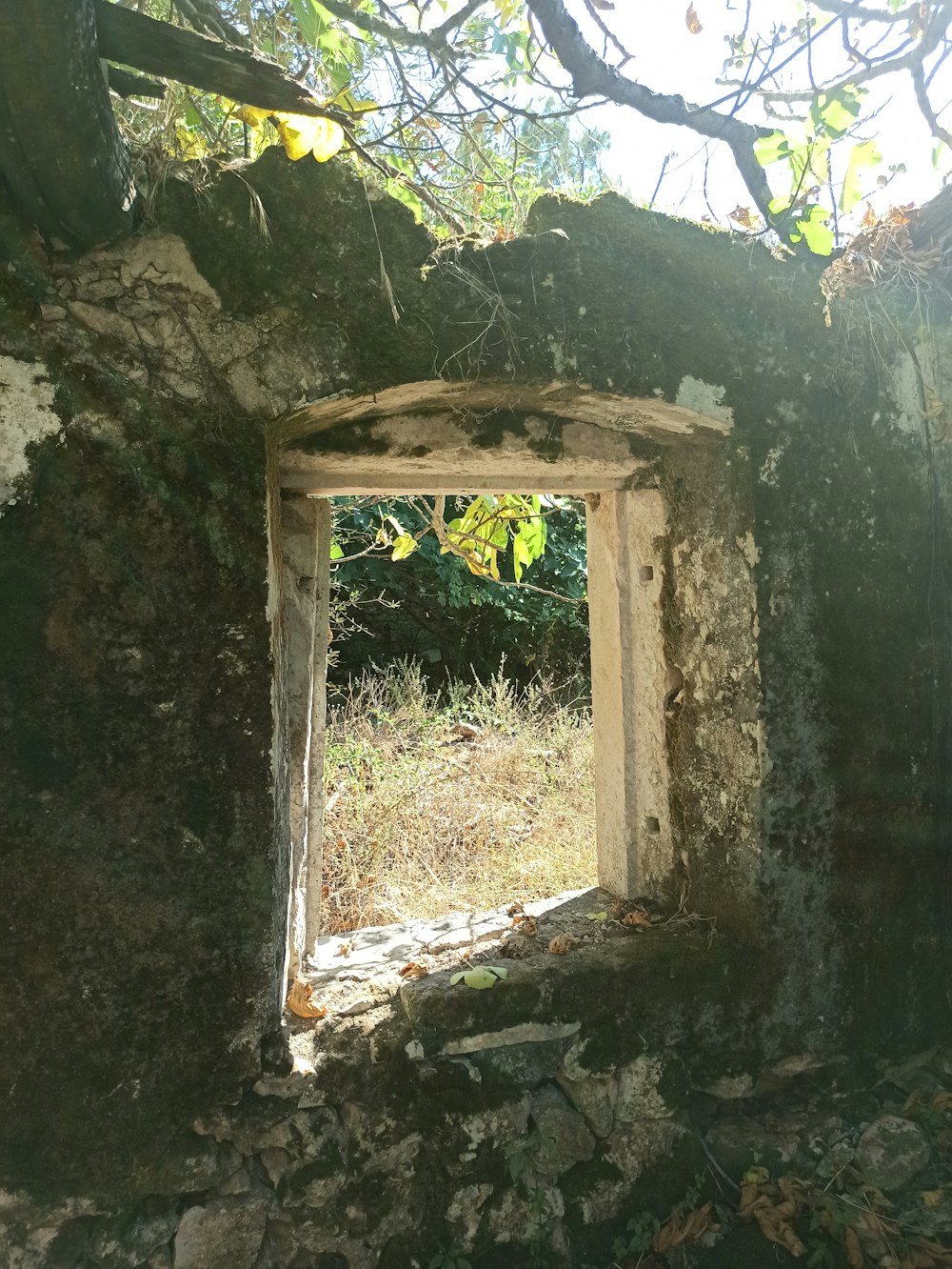 a stone doorway in a stone wall