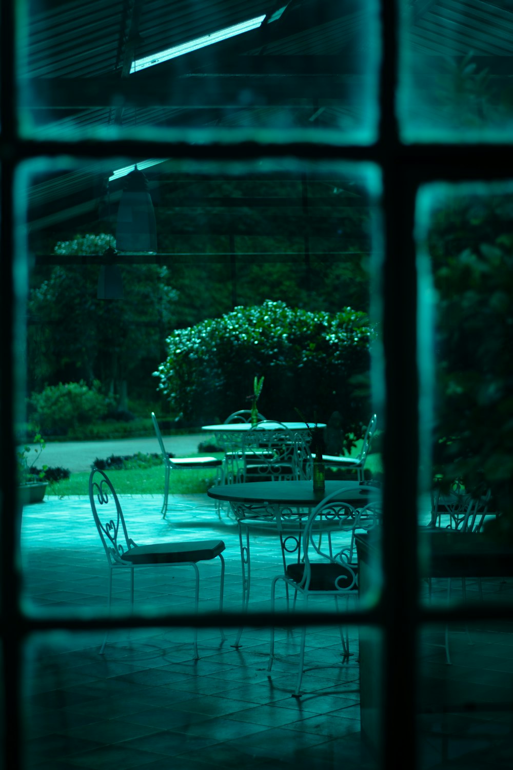 a patio with tables and chairs