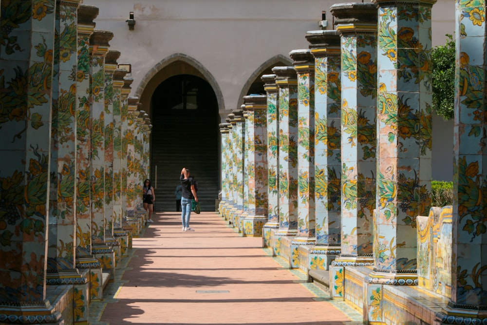 people walking in a corridor