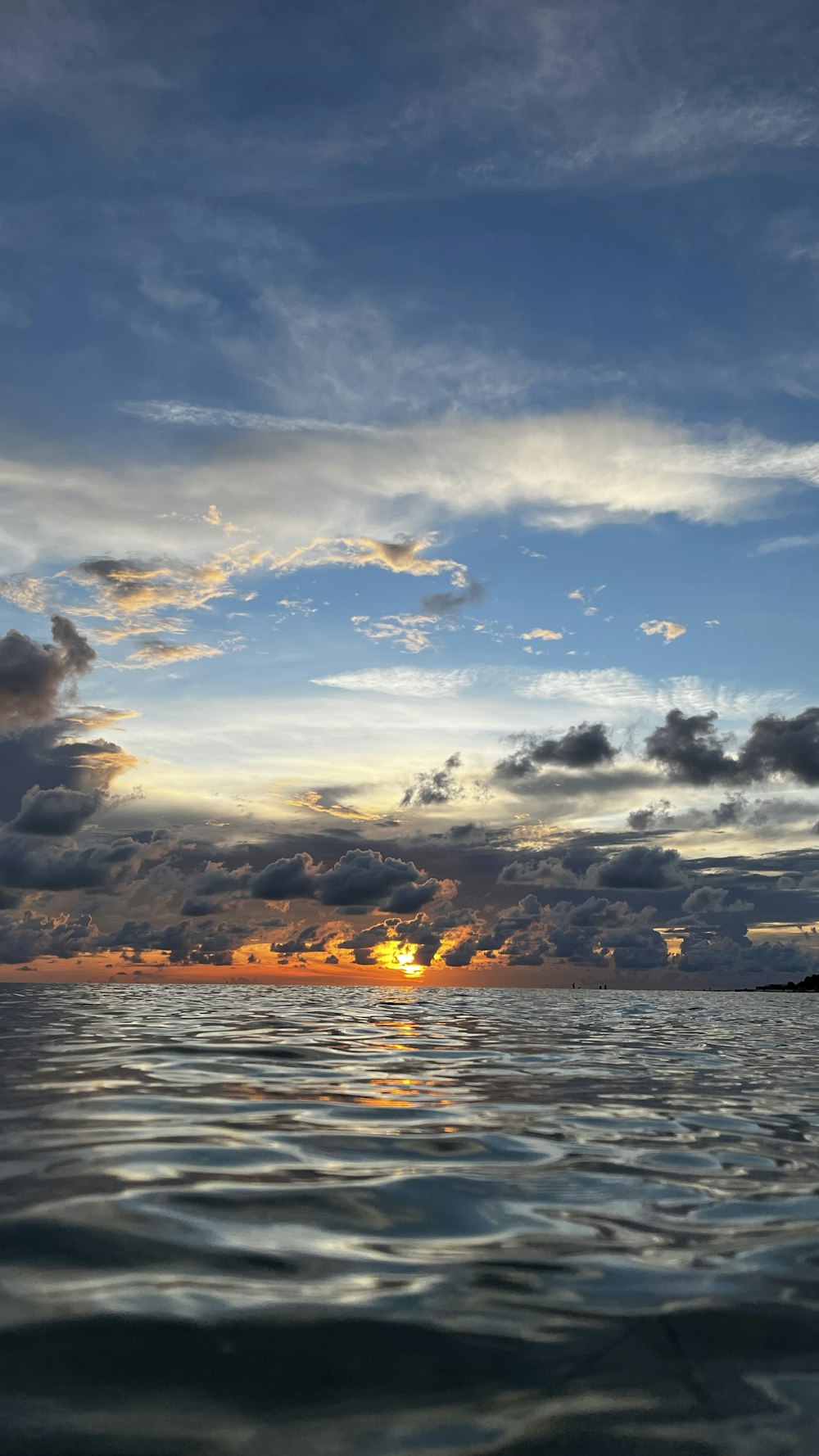 a sunset over a body of water