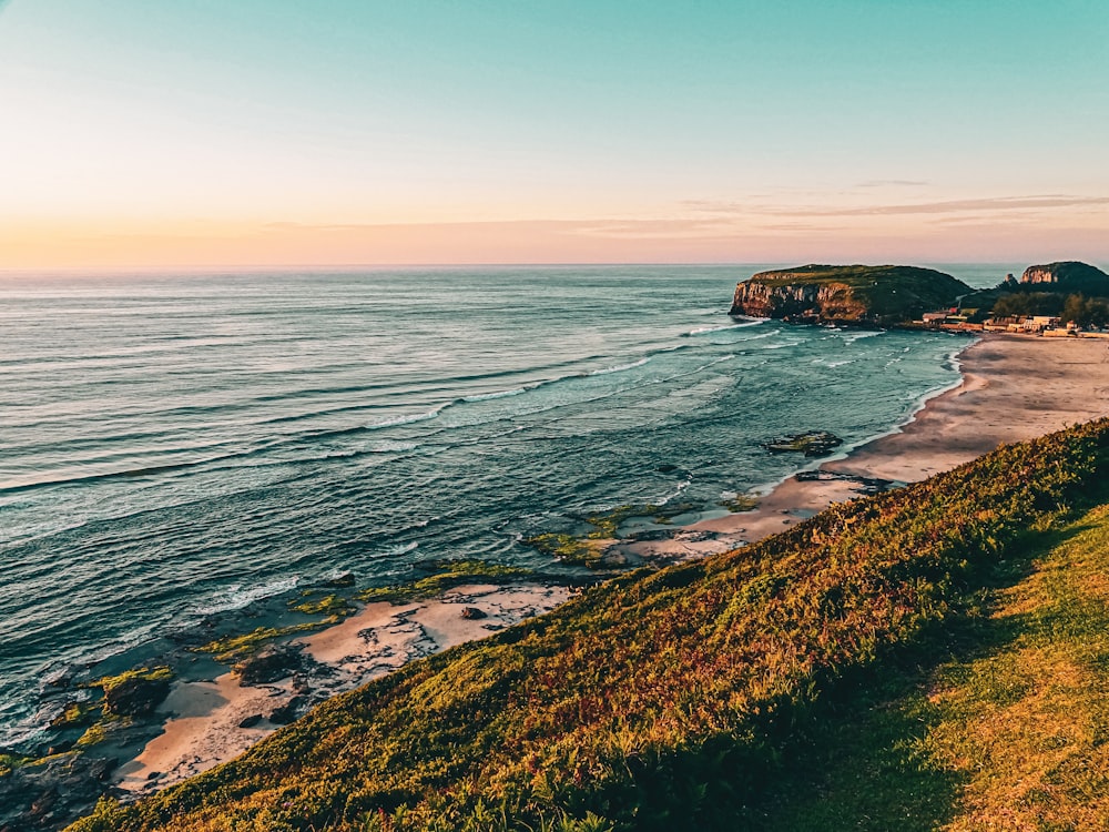 a beach with a body of water