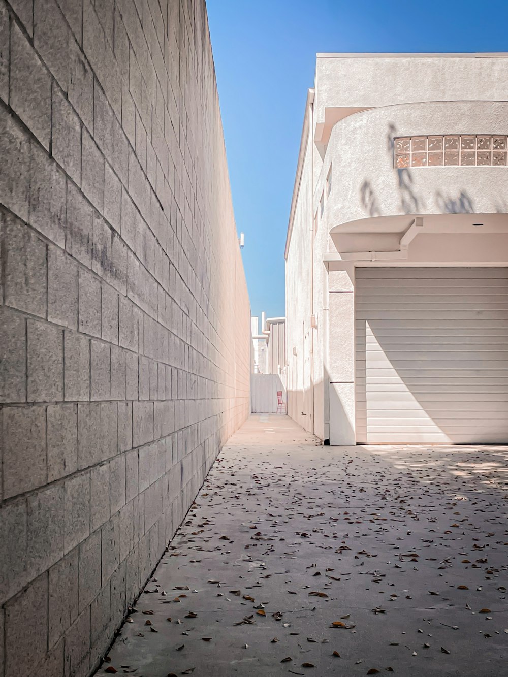 a stone walkway between two buildings