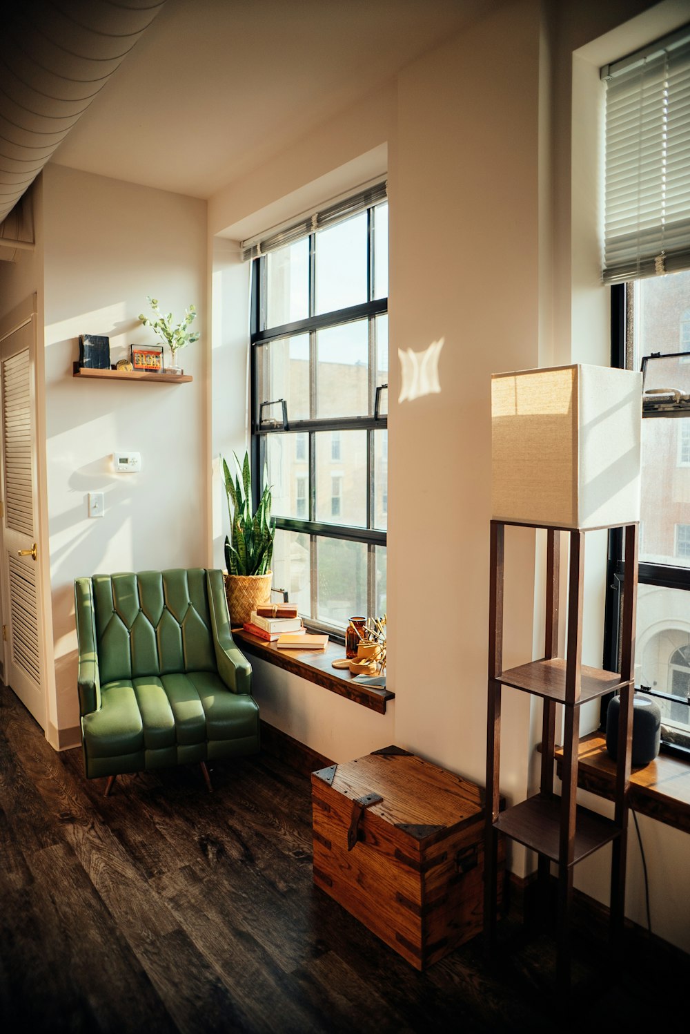 a room with a chair and a table with a box on it