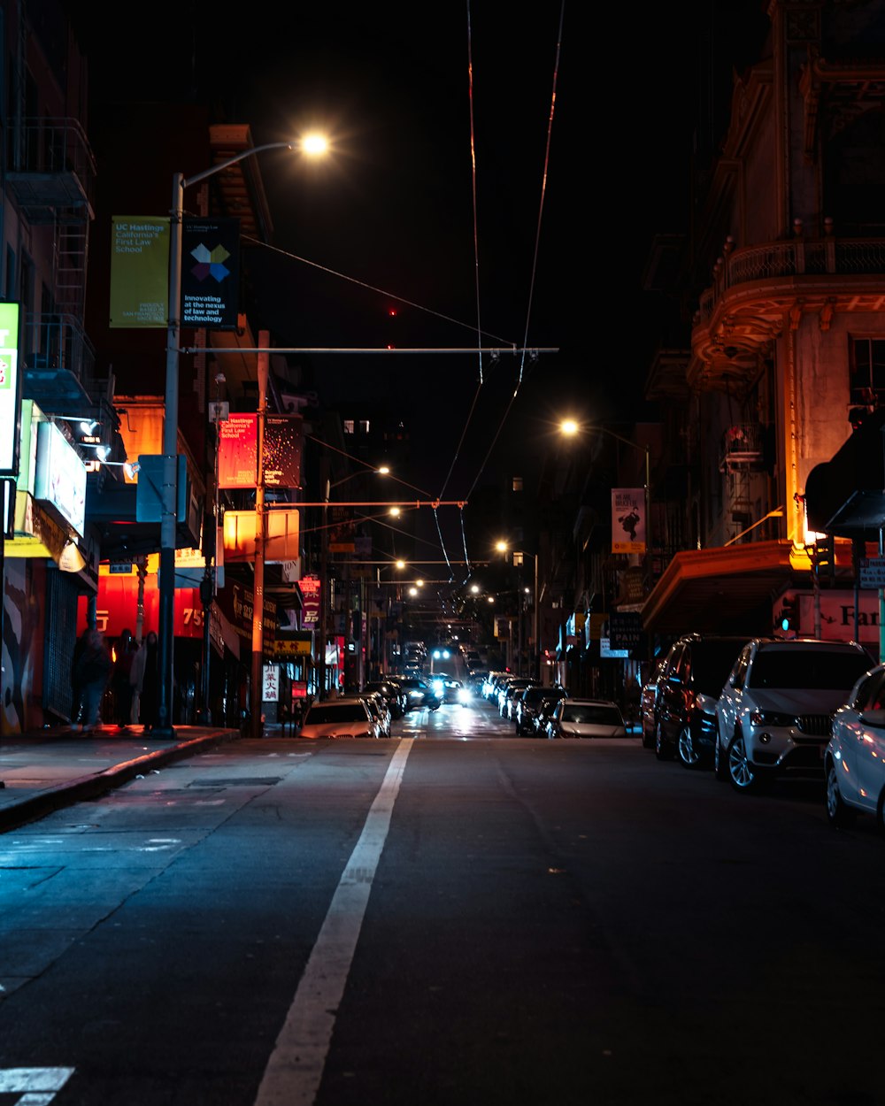 a street with cars on it at night