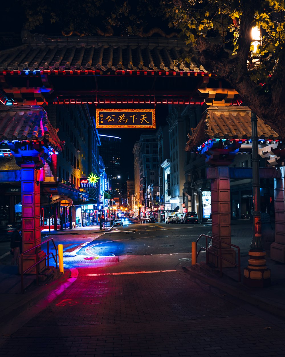 a street with buildings and lights