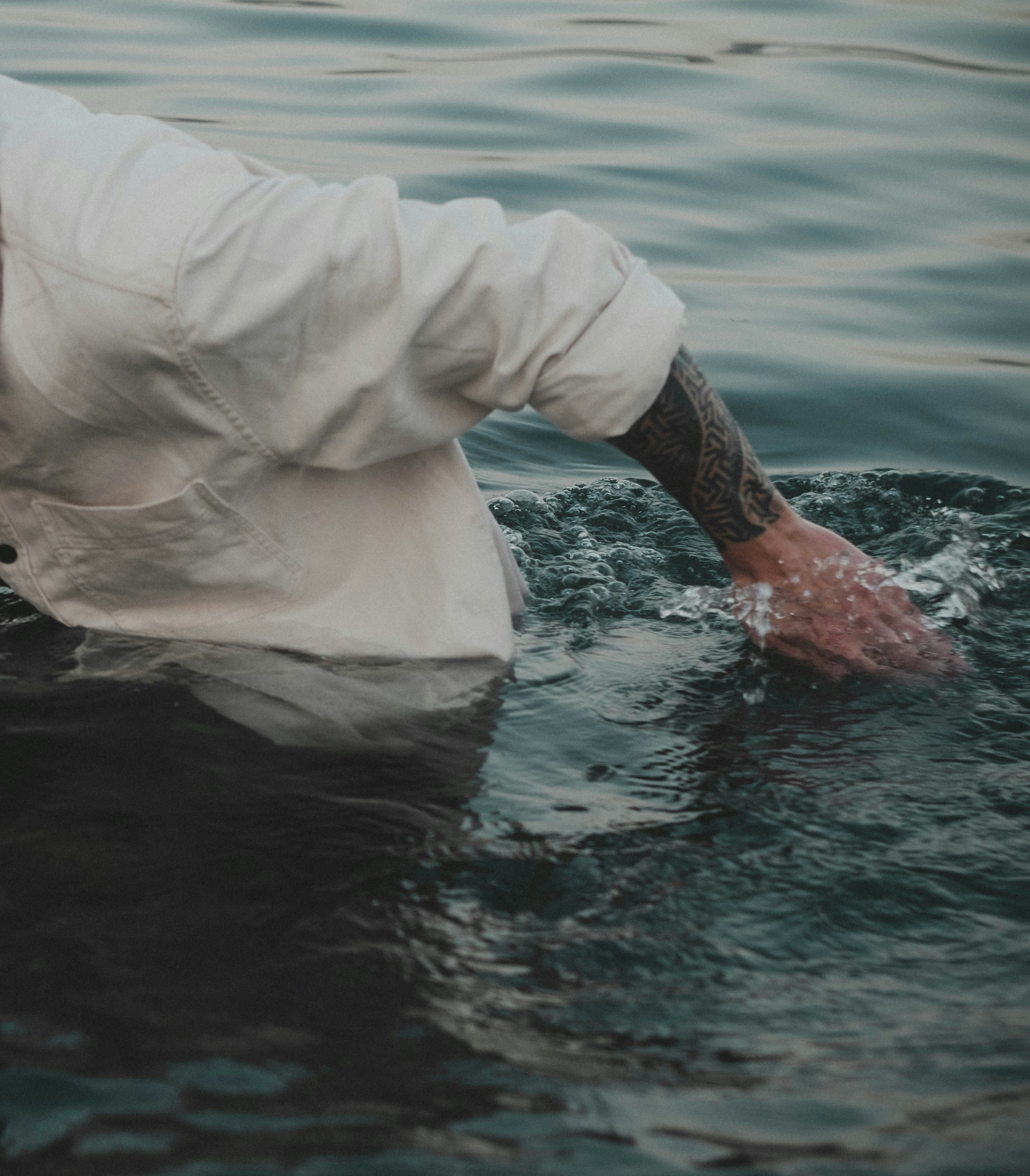 a person in a white shirt in water