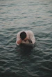 a man in a white shirt in the water