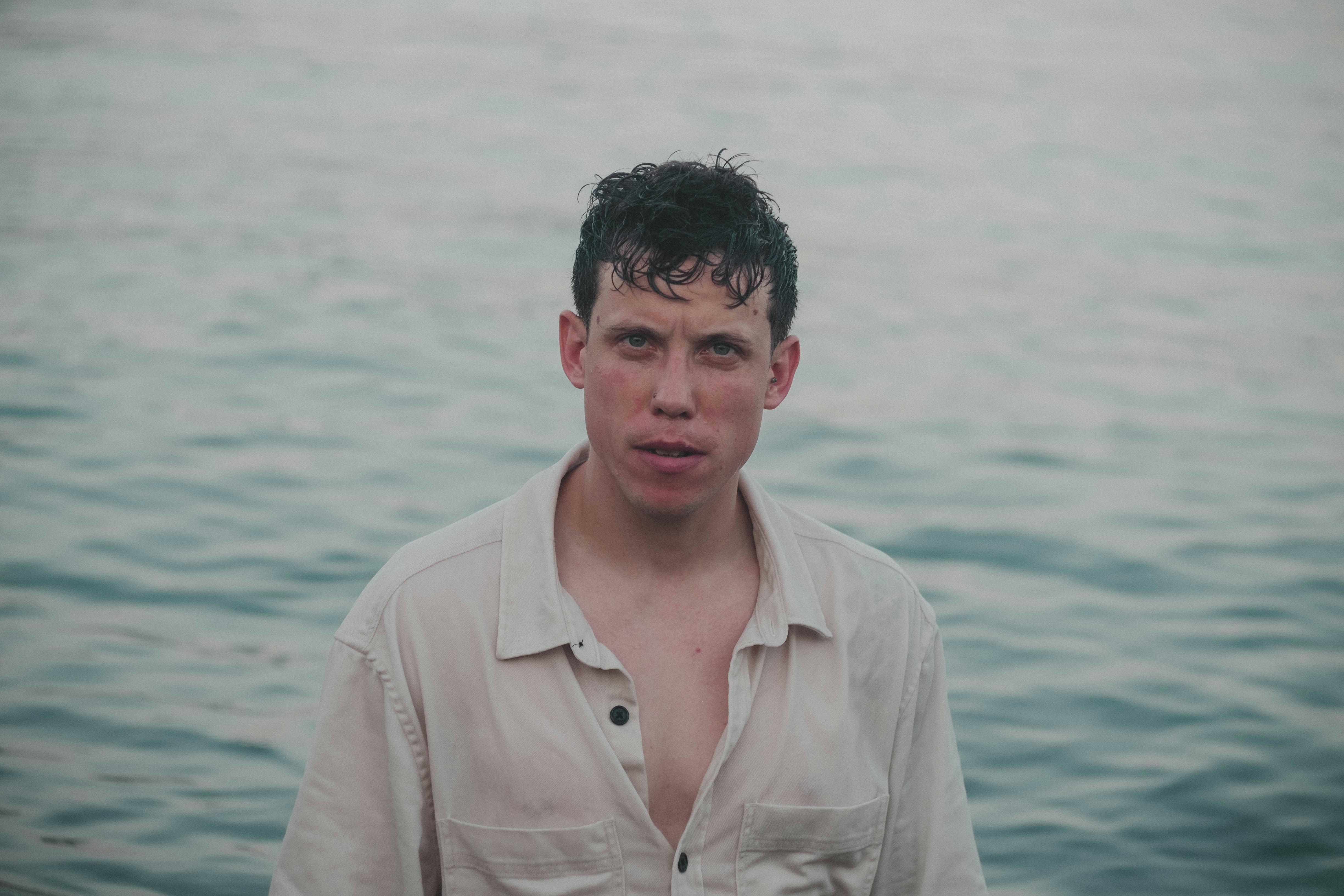 a person standing in front of a body of water