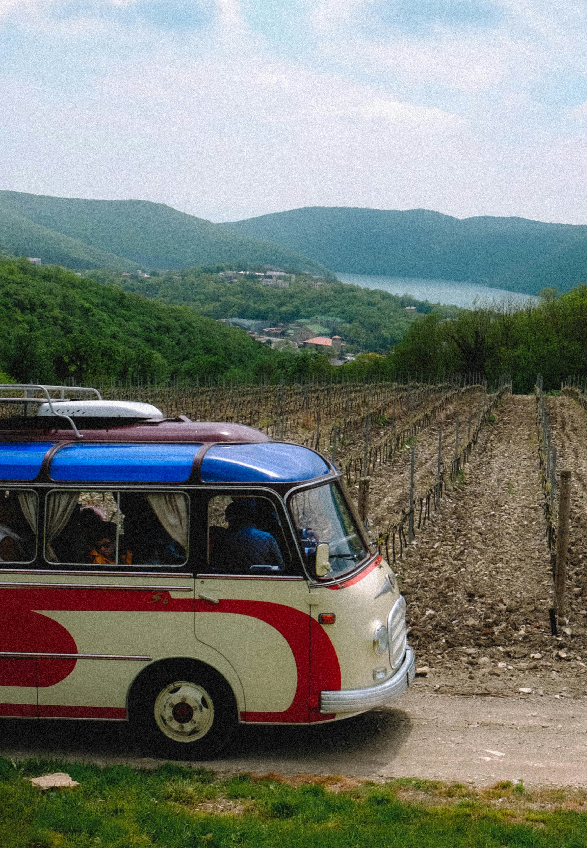 a bus parked on a dirt road