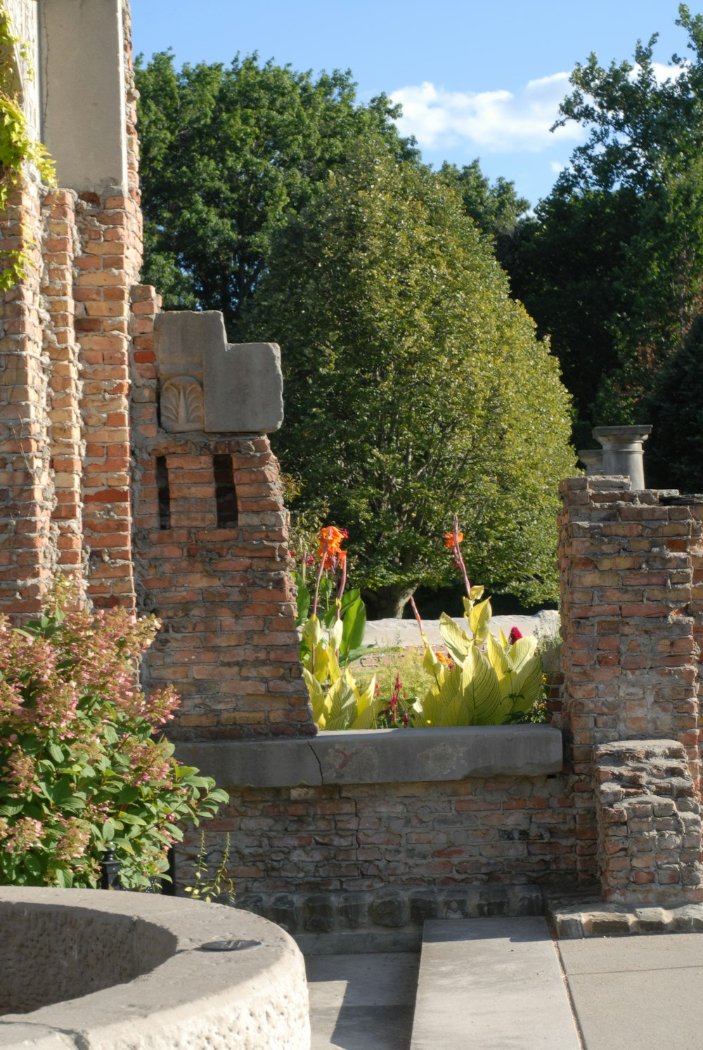 a stone statue in a garden