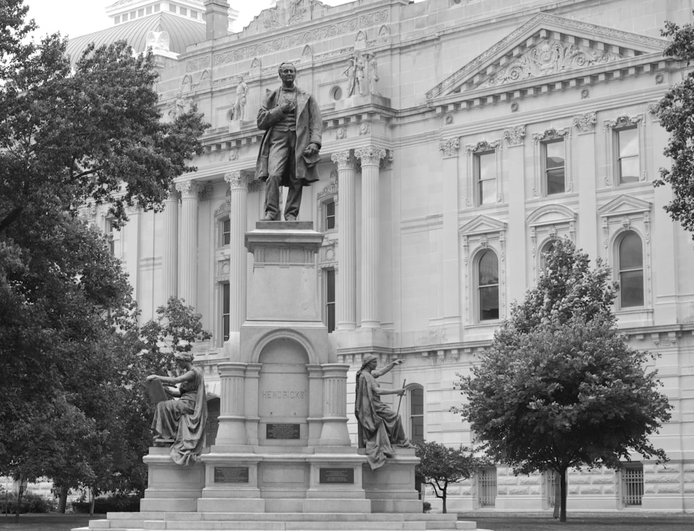 a statue in front of a building