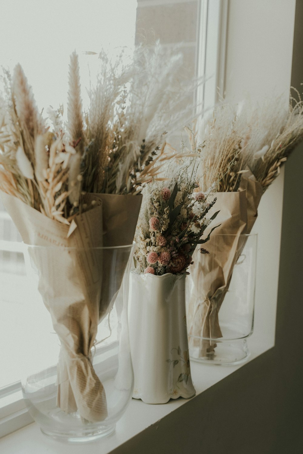 a couple of vases with flowers