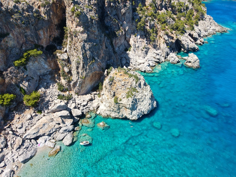 a group of rocks in the water