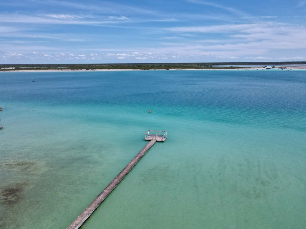 a long dock going into a body of water