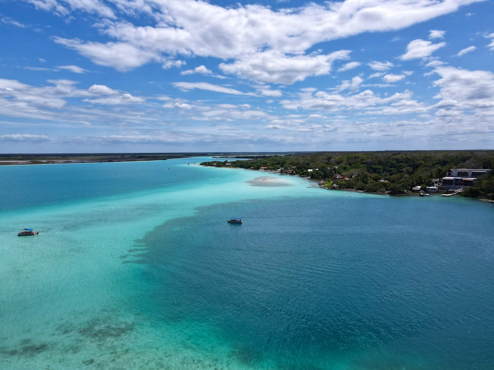 a body of water with land in the background