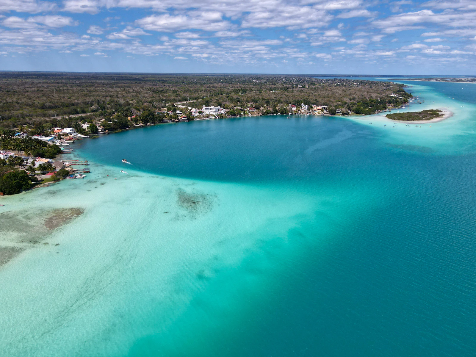 The Bacalar lagoon from above, its blues running from turquoise to deep green