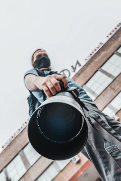 a person holding a camera