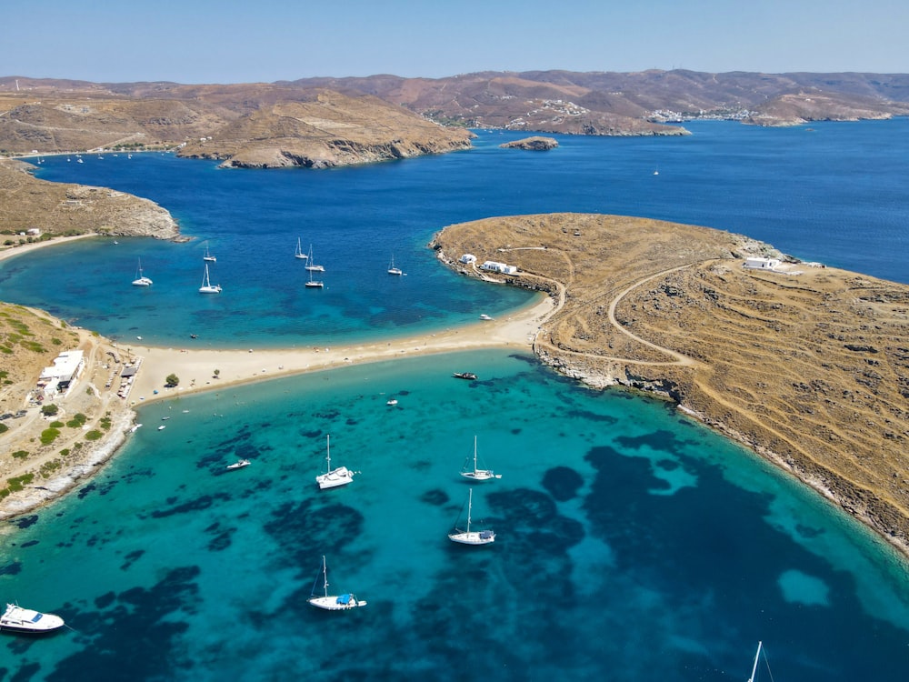 a body of water with boats in it and land around it