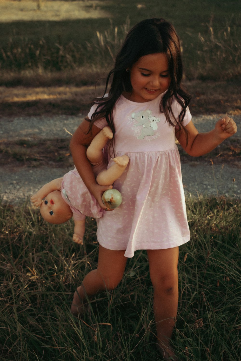 a girl holding a baby