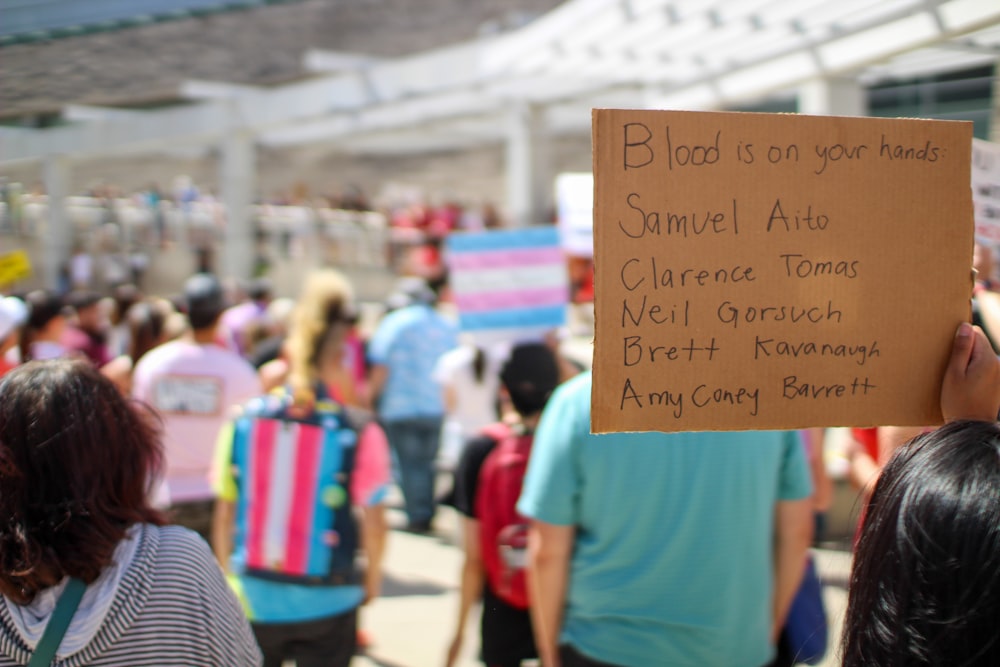 a person holding a sign