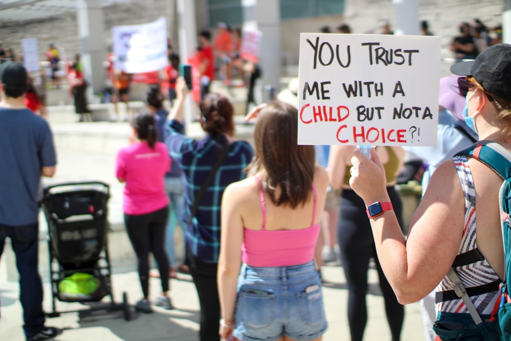 a person holding a sign