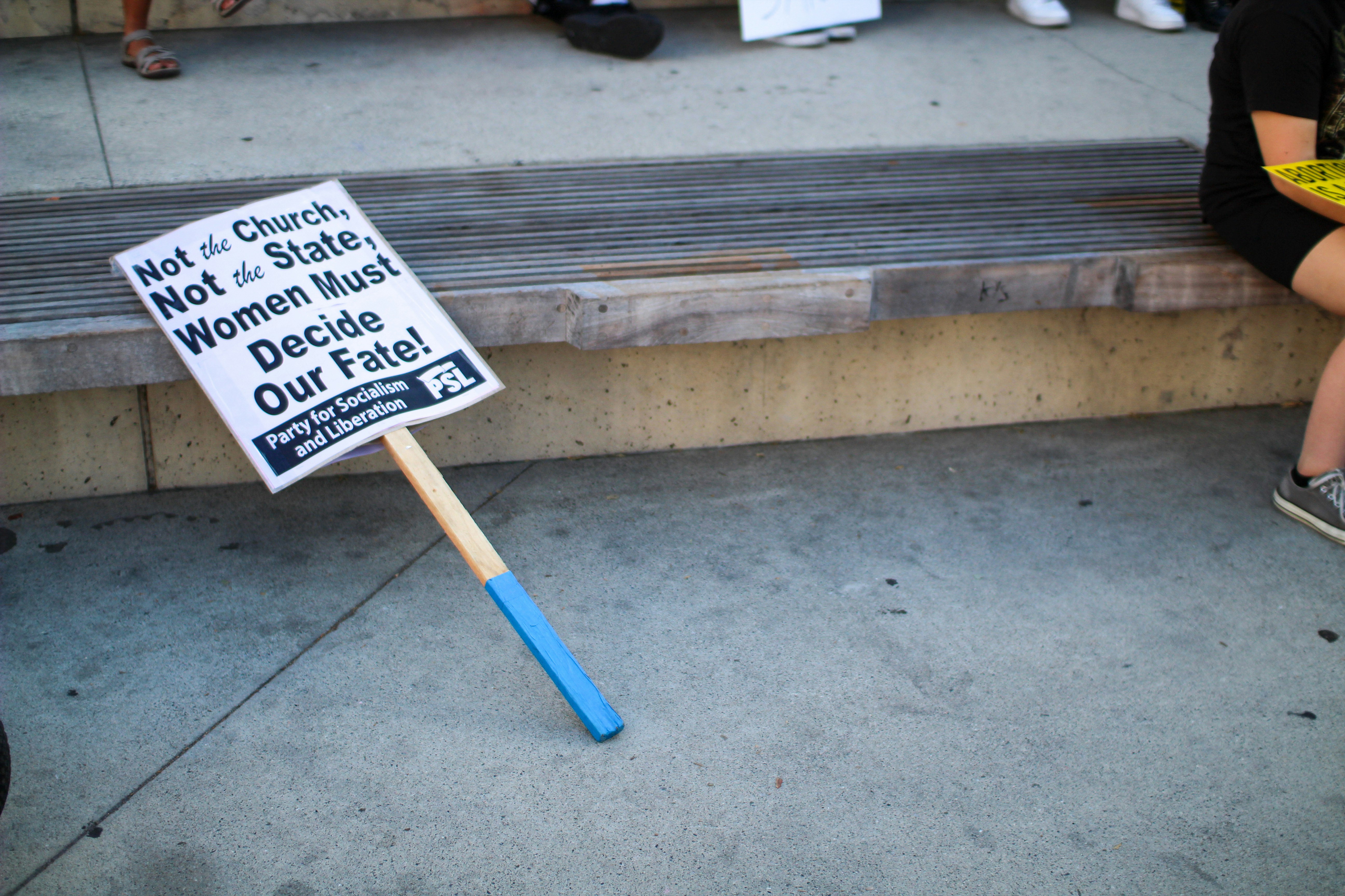 a sign on the sidewalk
