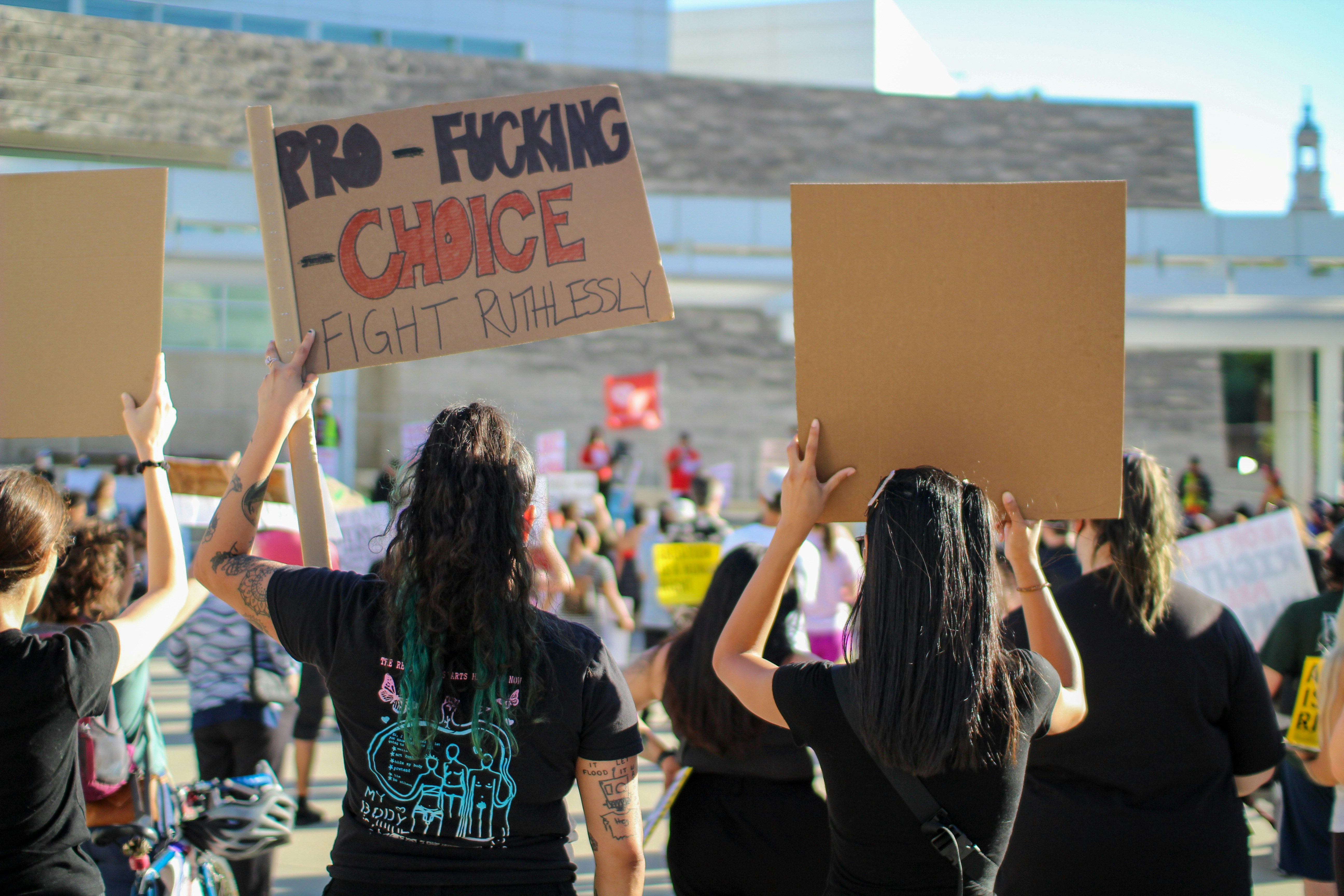 a group of people holding signs