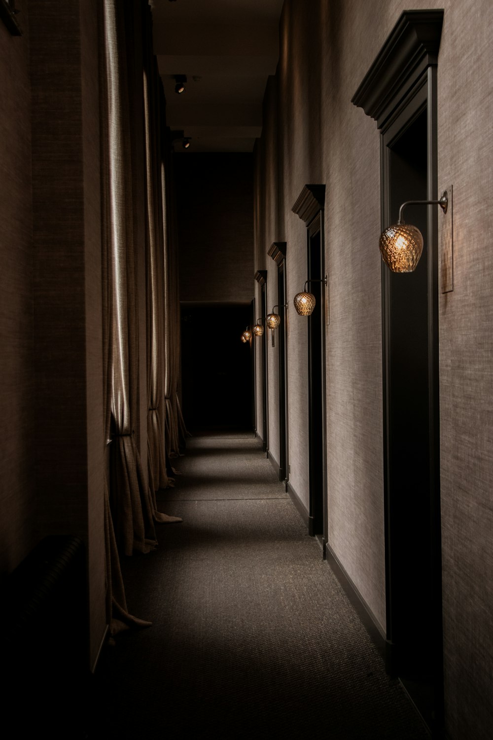 a hallway with light fixtures