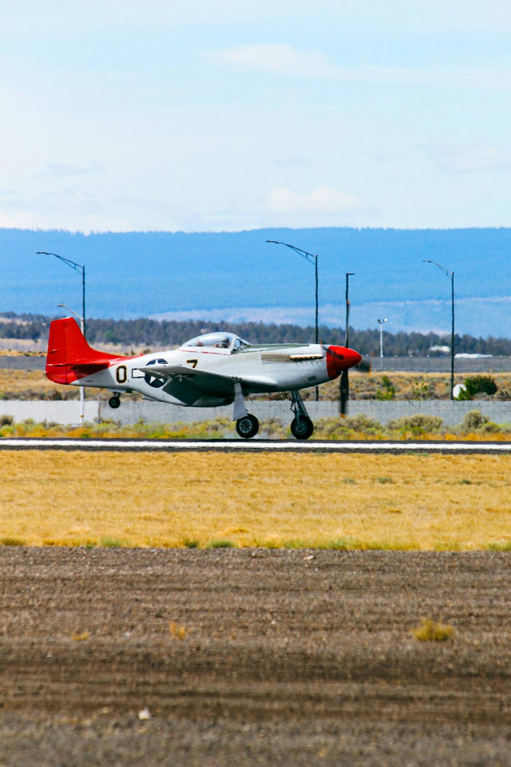 a couple of airplanes on a runway