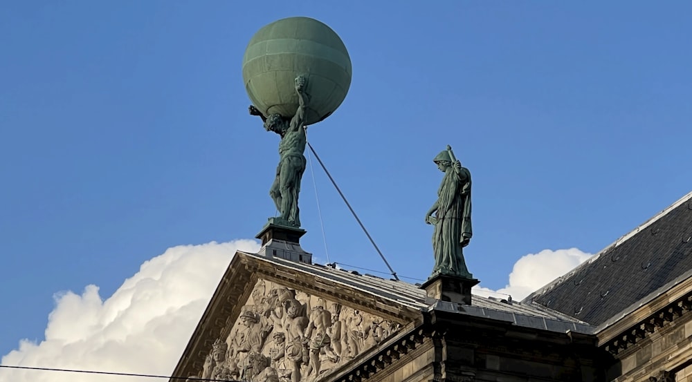 a statue on top of a building