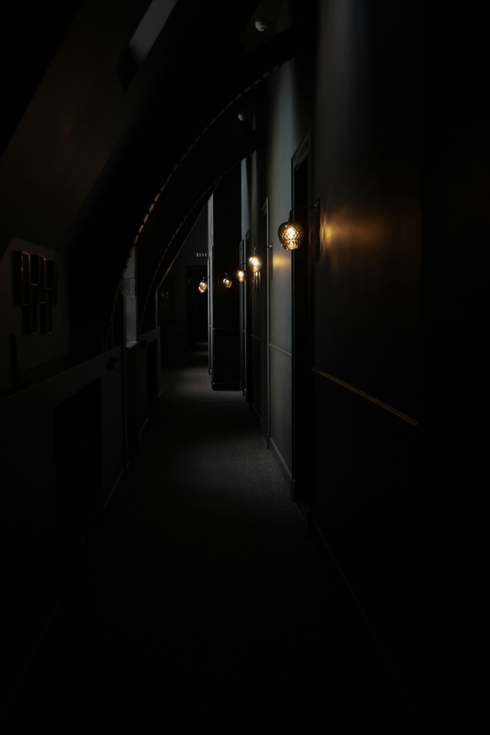 a dark hallway with lights