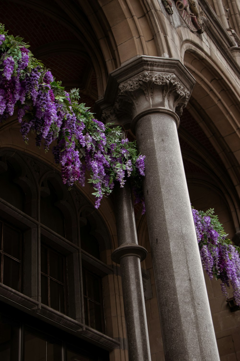purple flowers on a pillar