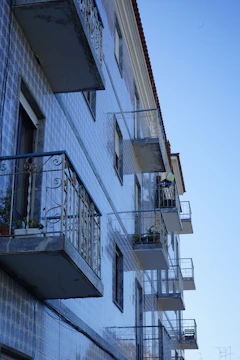 Balcony floor tiled with weather-resistant ceramic tiles, overlooking a peaceful Ankara neighborhood.