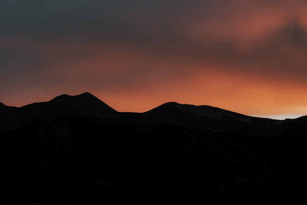 a mountain range at sunset
