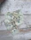 Close-up photo of realistic prop money spread out on a wooden table.