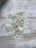 Close-up photo of realistic prop money spread out on a wooden table.
