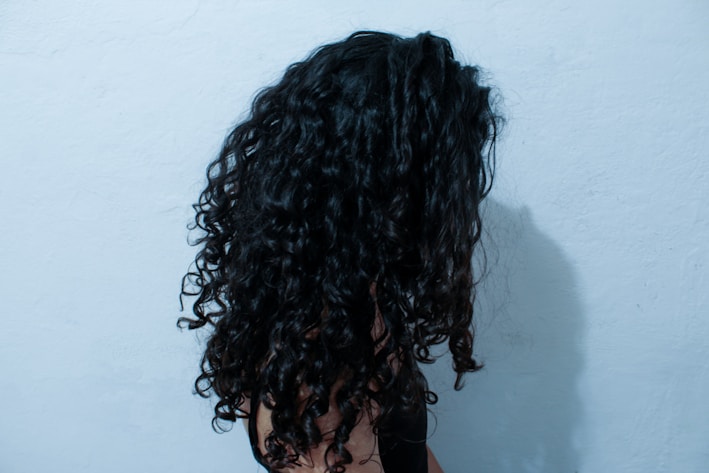 a person with the hair pulled back