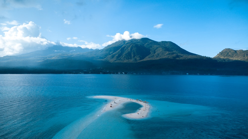 a beach with a mountain in the background