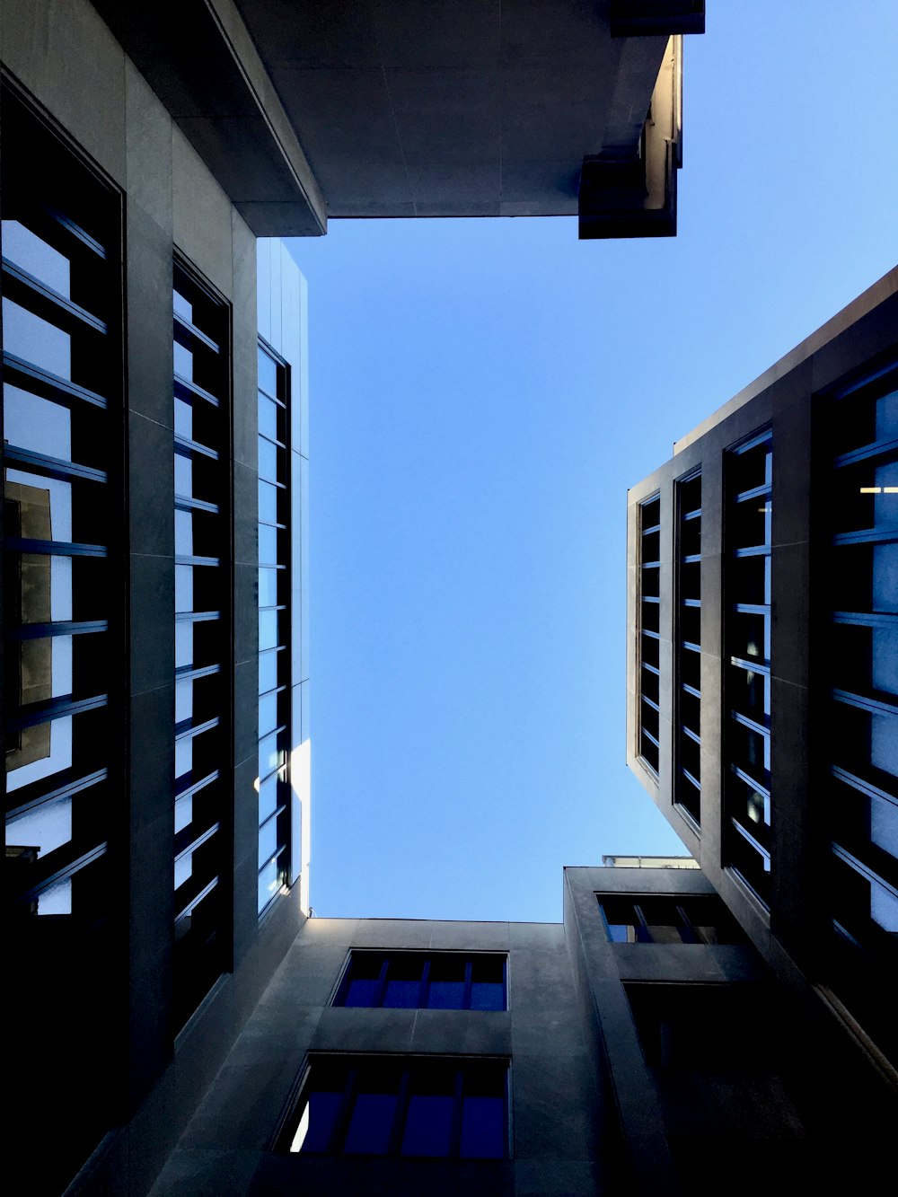 looking up at tall buildings