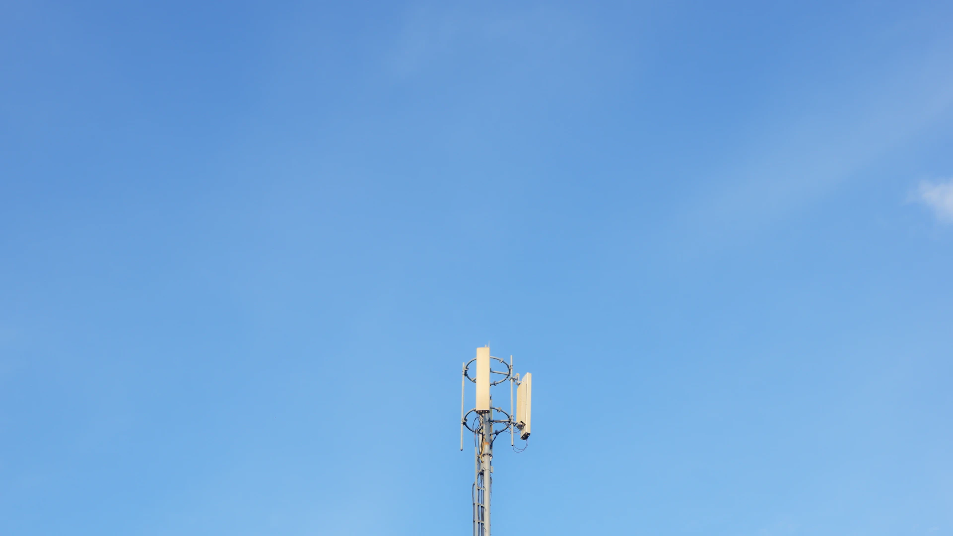 a white tower with a blue sky