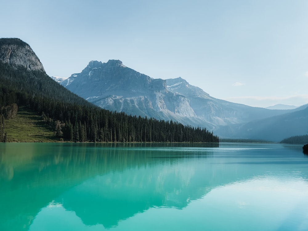 a lake with mountains in the background