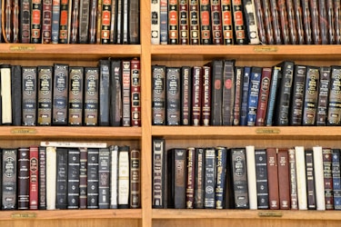 a shelf with many books on it