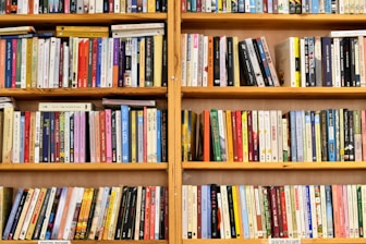 a shelf with many books on it