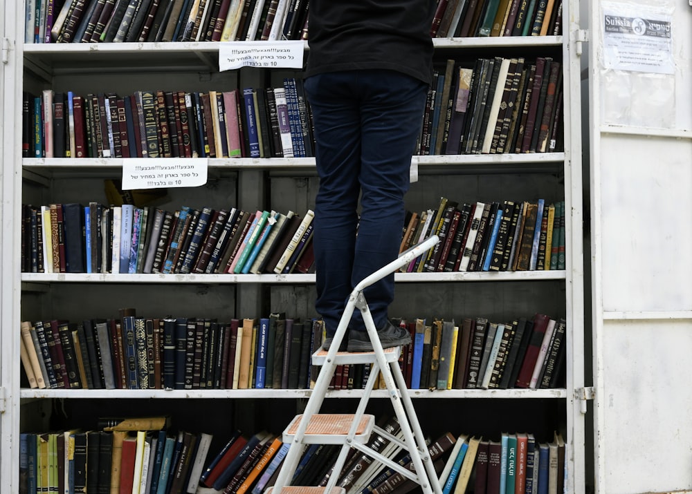 a person standing on a shelf