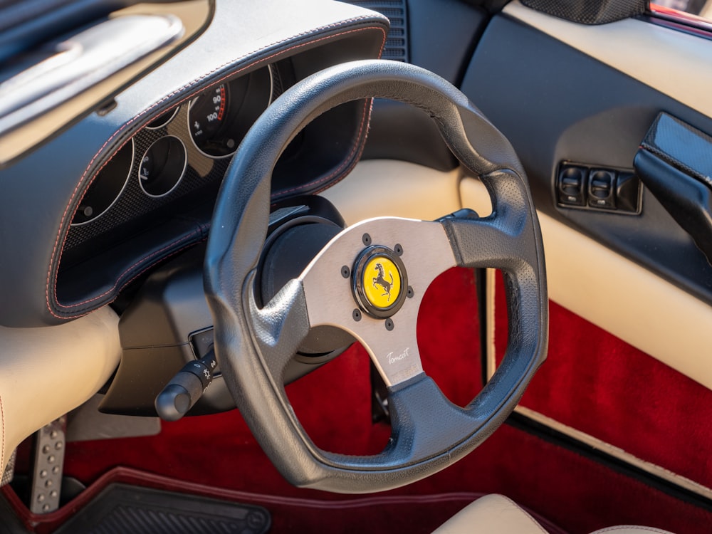 a steering wheel and dashboard of a car