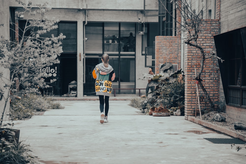 a man walking on a sidewalk